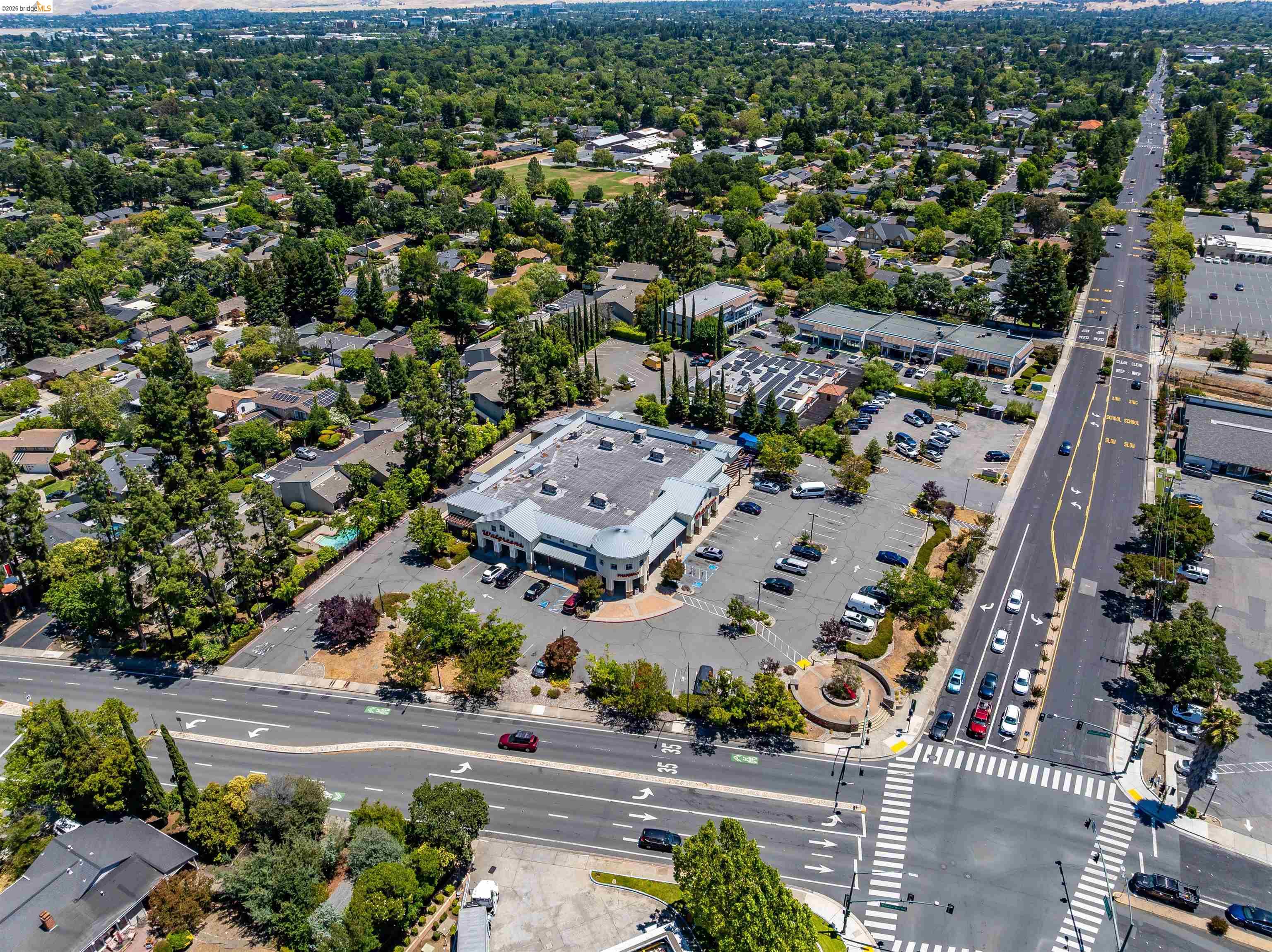 346 Valley View Road Pleasant Hill, CA 94523 - Photo 55 of 57 Commercial property featuring a large parking area, surrounding green landscaping, and multiple access points from a prominent thoroughfare