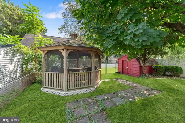 a view of a wooden deck with a yard