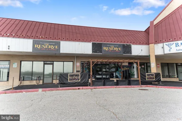 a view of a store with parking