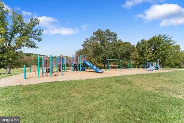 a view of a park with swings and slides