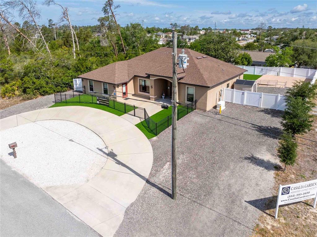 Undisclosed Address Spring Hill, FL 34608 - Photo 39 of 39 an aerial view of a house with a yard