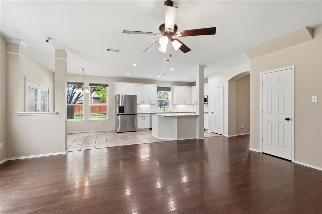 13236 Ridgepointe Road Fort Worth, TX 76244 - Photo 5 of 19 a view of a kitchen with wooden floor and a window