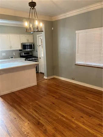 a view of a kitchen from the hallway