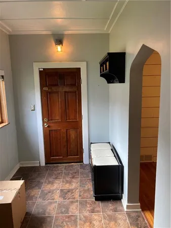 a view of entryway with a rug and a window