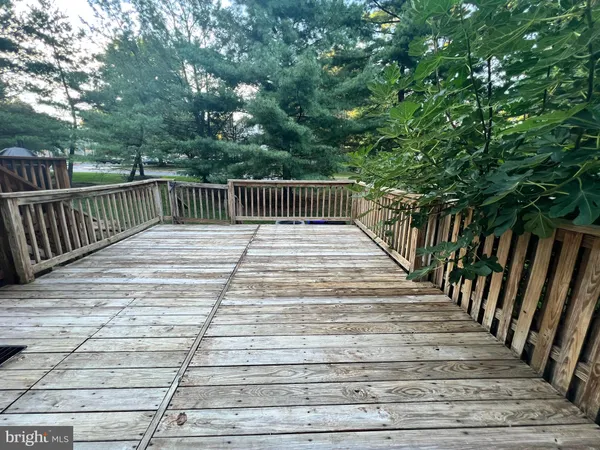 a balcony with trees in front of it