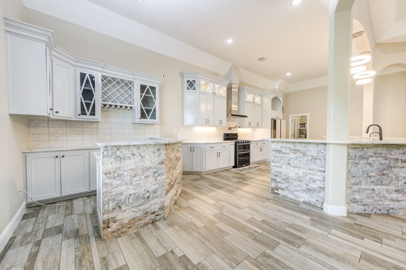 21038 Angus Drive Cleveland, TX 77328 - Photo 15 of 49 a large kitchen with cabinets and wooden floor