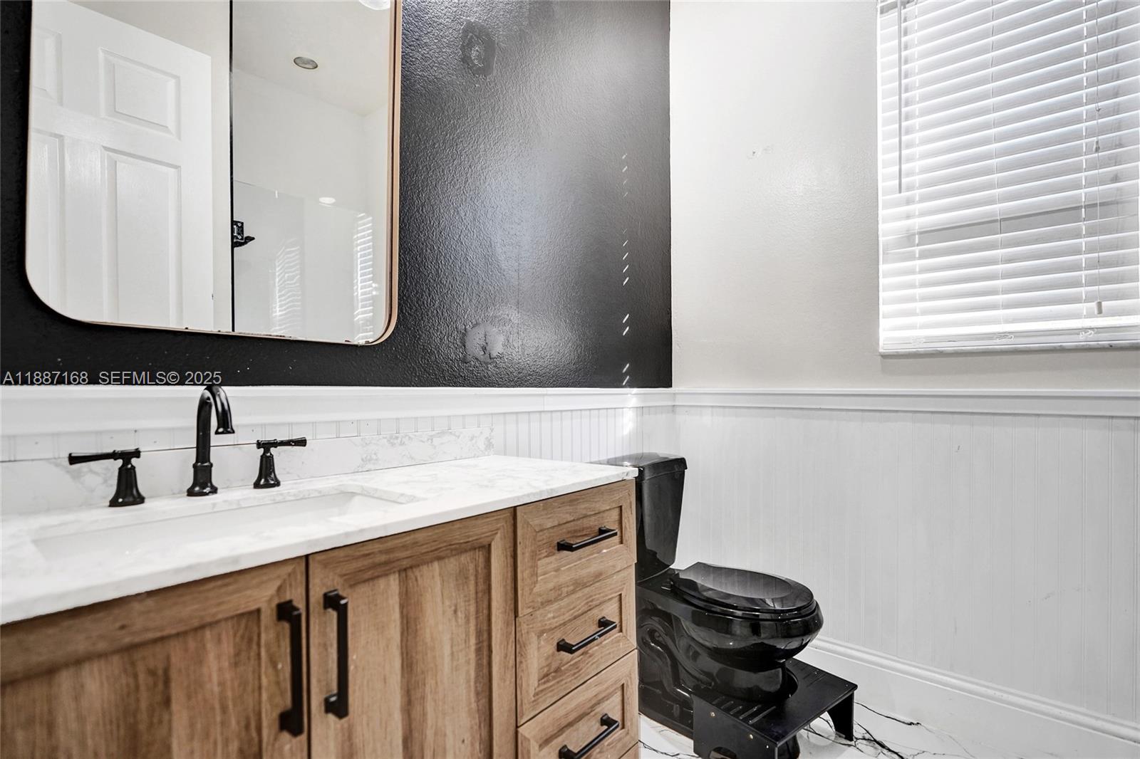 8824 Cobblestone Point Circle Boynton Beach, FL 33472 - Photo 19 of 53 a bathroom with a sink vanity and a mirror