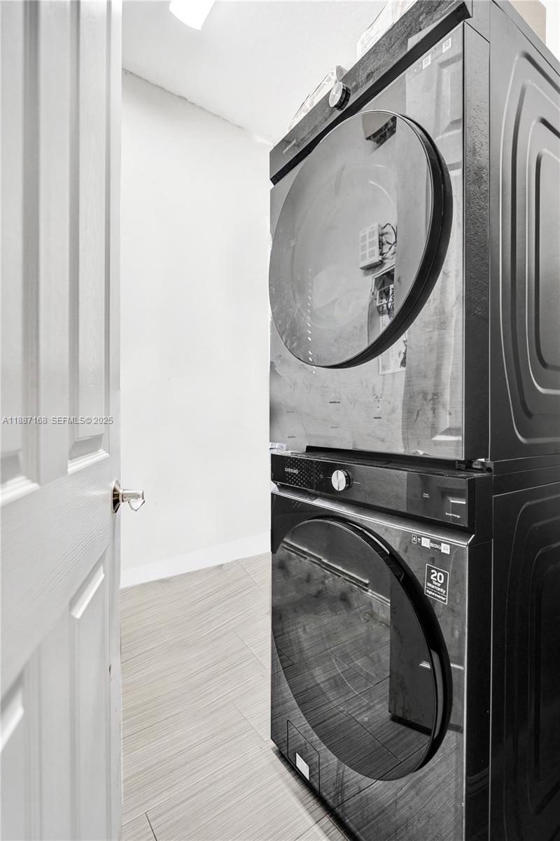 8824 Cobblestone Point Circle Boynton Beach, FL 33472 - Photo 22 of 53 a utility room with a sink dryer and washer