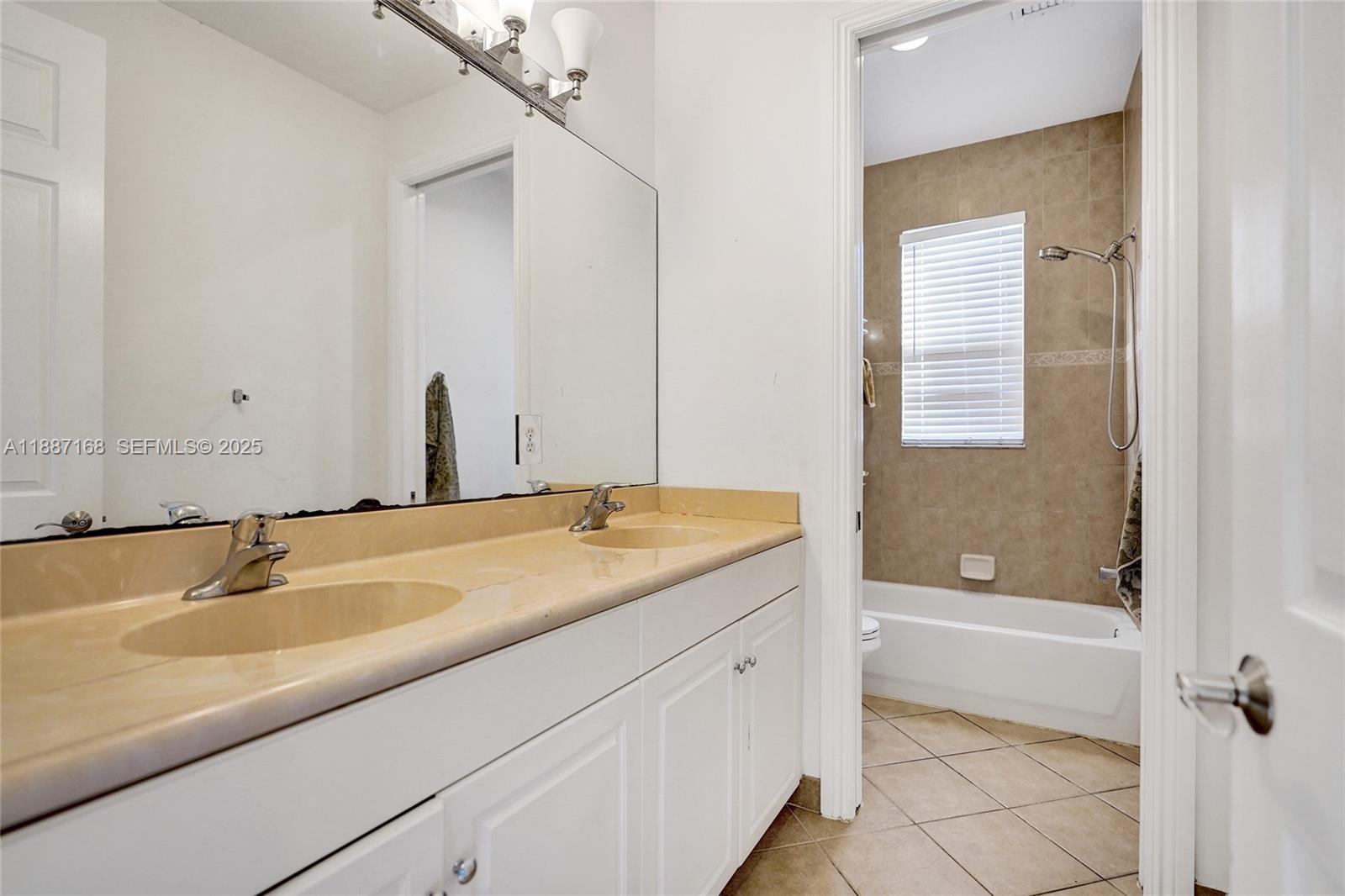 8824 Cobblestone Point Circle Boynton Beach, FL 33472 - Photo 27 of 53 a bathroom with a granite countertop sink and a bathtub