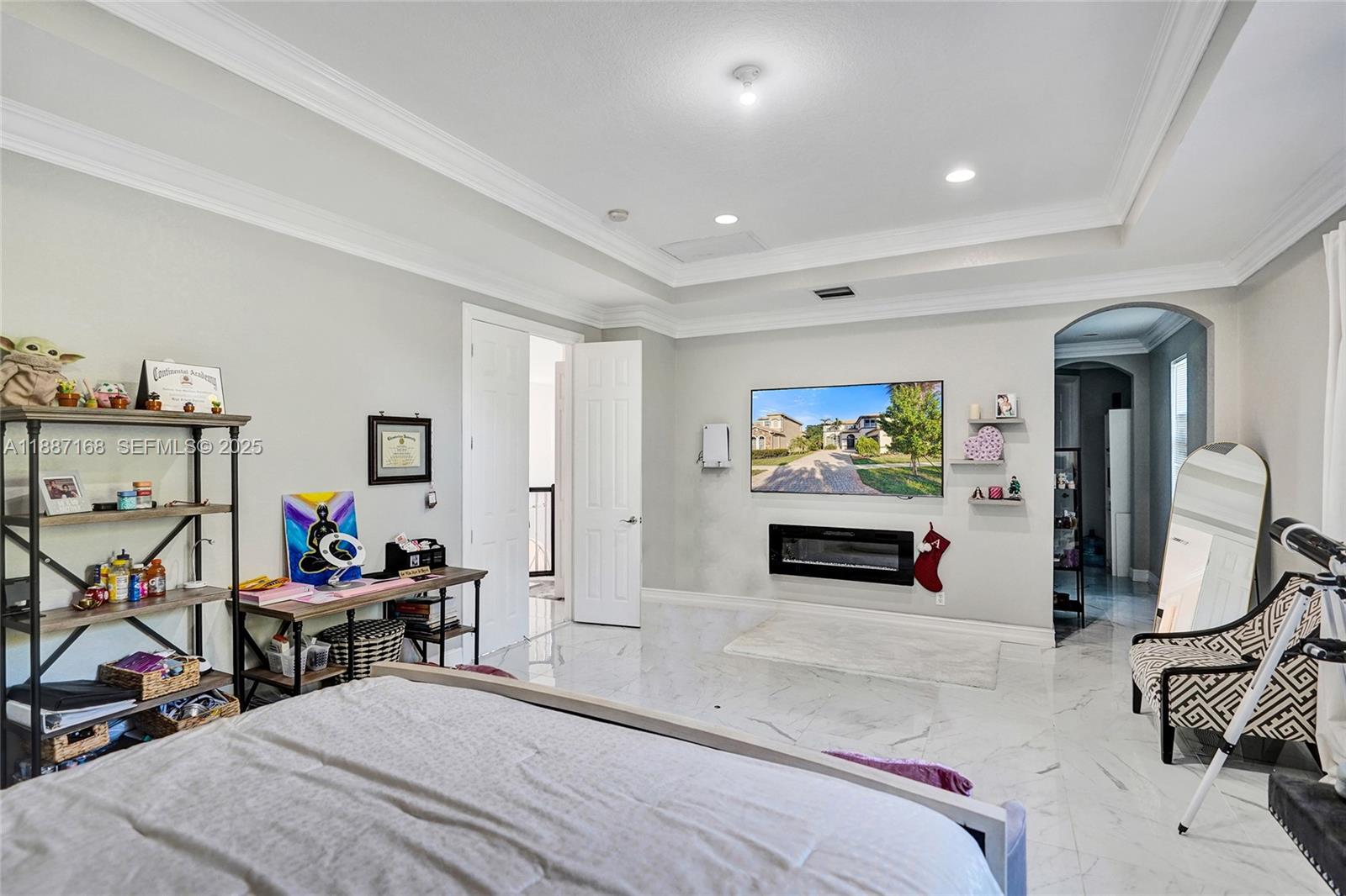 8824 Cobblestone Point Circle Boynton Beach, FL 33472 - Photo 34 of 53 a bedroom with furniture and a flat screen tv