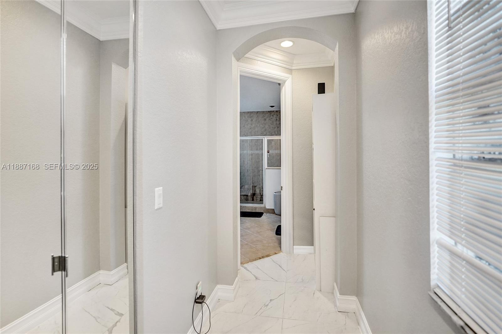 8824 Cobblestone Point Circle Boynton Beach, FL 33472 - Photo 35 of 53 a bathroom with a walk in closet and a bathroom
