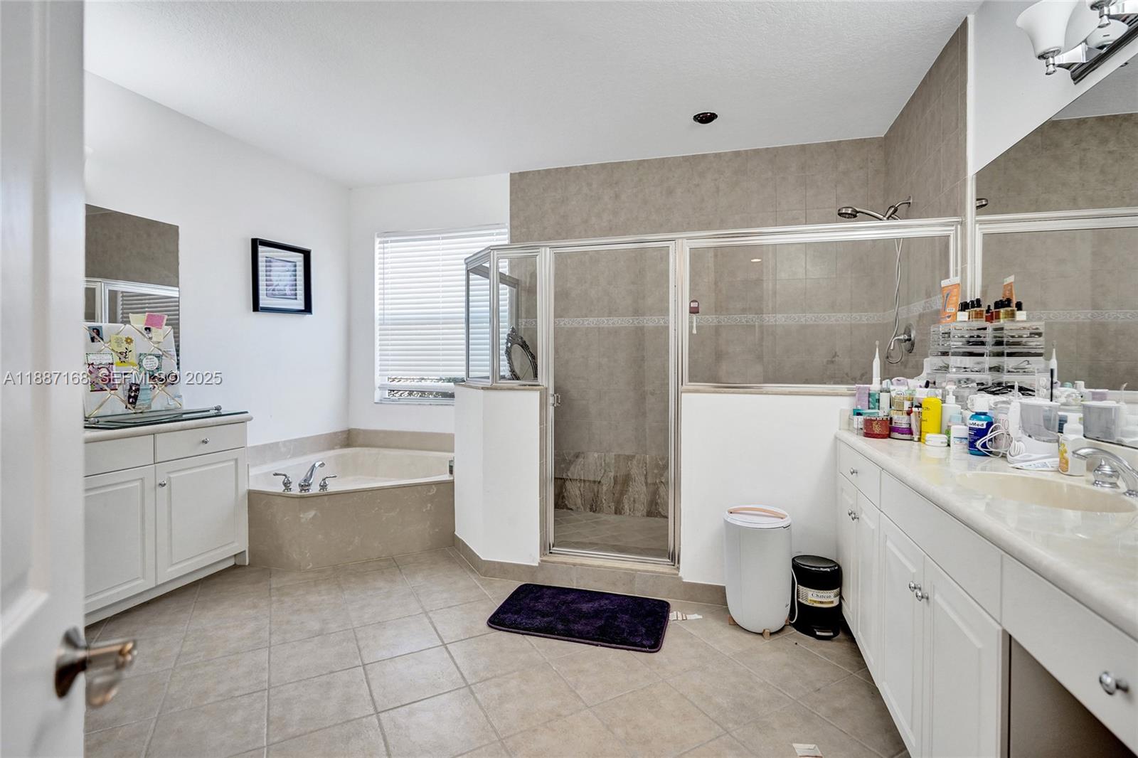 8824 Cobblestone Point Circle Boynton Beach, FL 33472 - Photo 36 of 53 a room with a white cabinets and white appliances