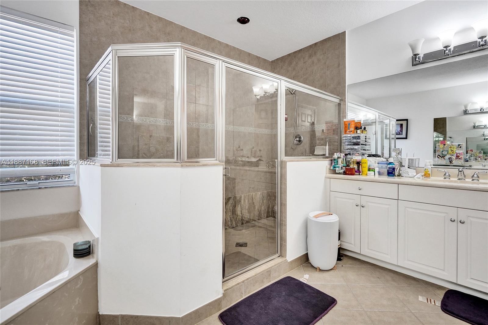 8824 Cobblestone Point Circle Boynton Beach, FL 33472 - Photo 38 of 53 a bathroom with a sink toilet and shower