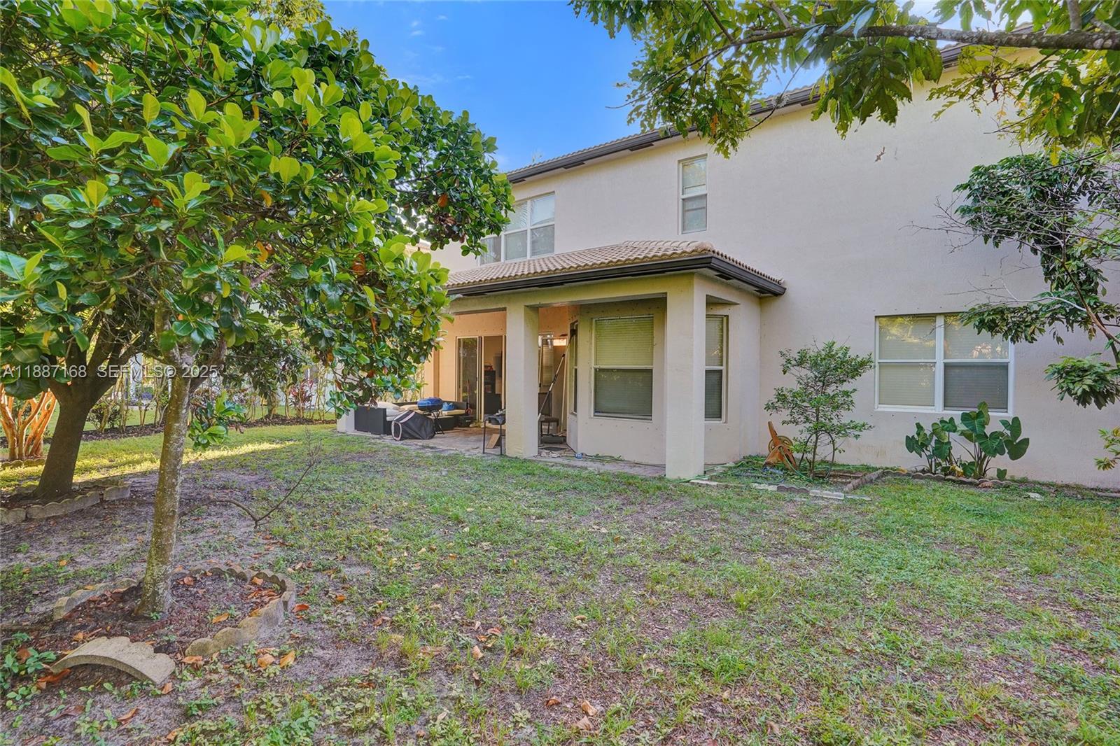 8824 Cobblestone Point Circle Boynton Beach, FL 33472 - Photo 41 of 53 a view of a house with a yard