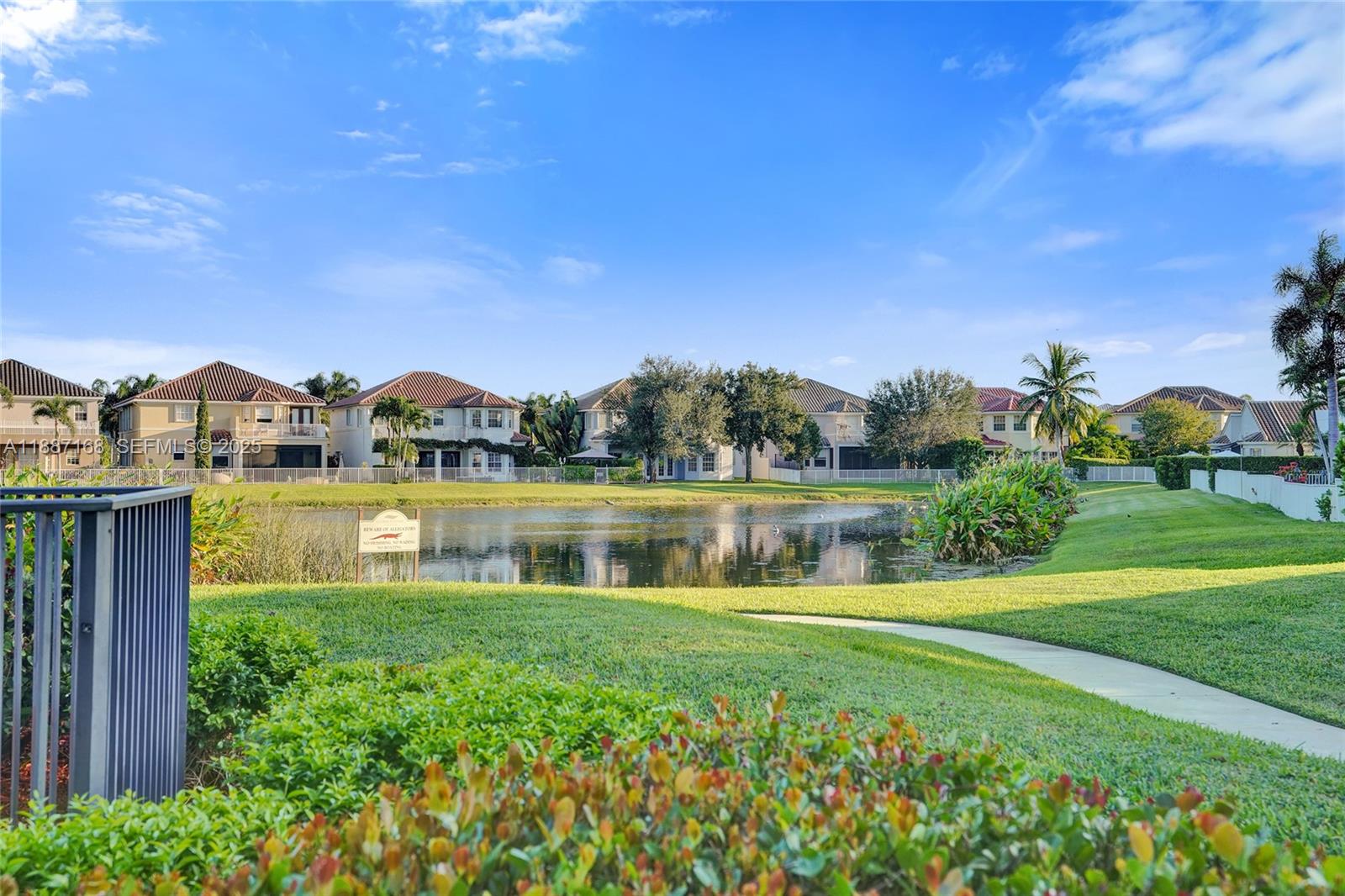 8824 Cobblestone Point Circle Boynton Beach, FL 33472 - Photo 48 of 53 a view of lake with a house in the background