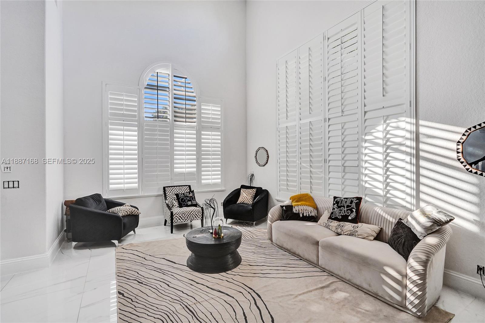 8824 Cobblestone Point Circle Boynton Beach, FL 33472 - Photo 6 of 53 a living room with furniture or couch and a potted plant