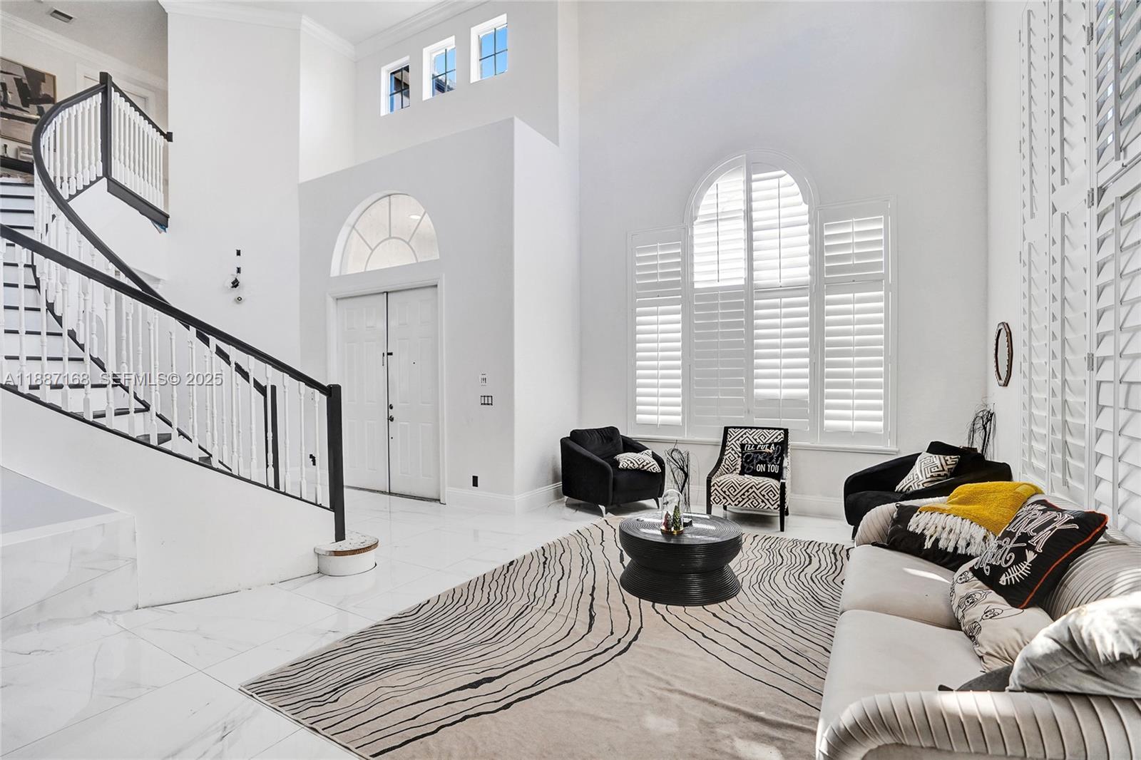8824 Cobblestone Point Circle Boynton Beach, FL 33472 - Photo 7 of 53 a living room with furniture and a large window