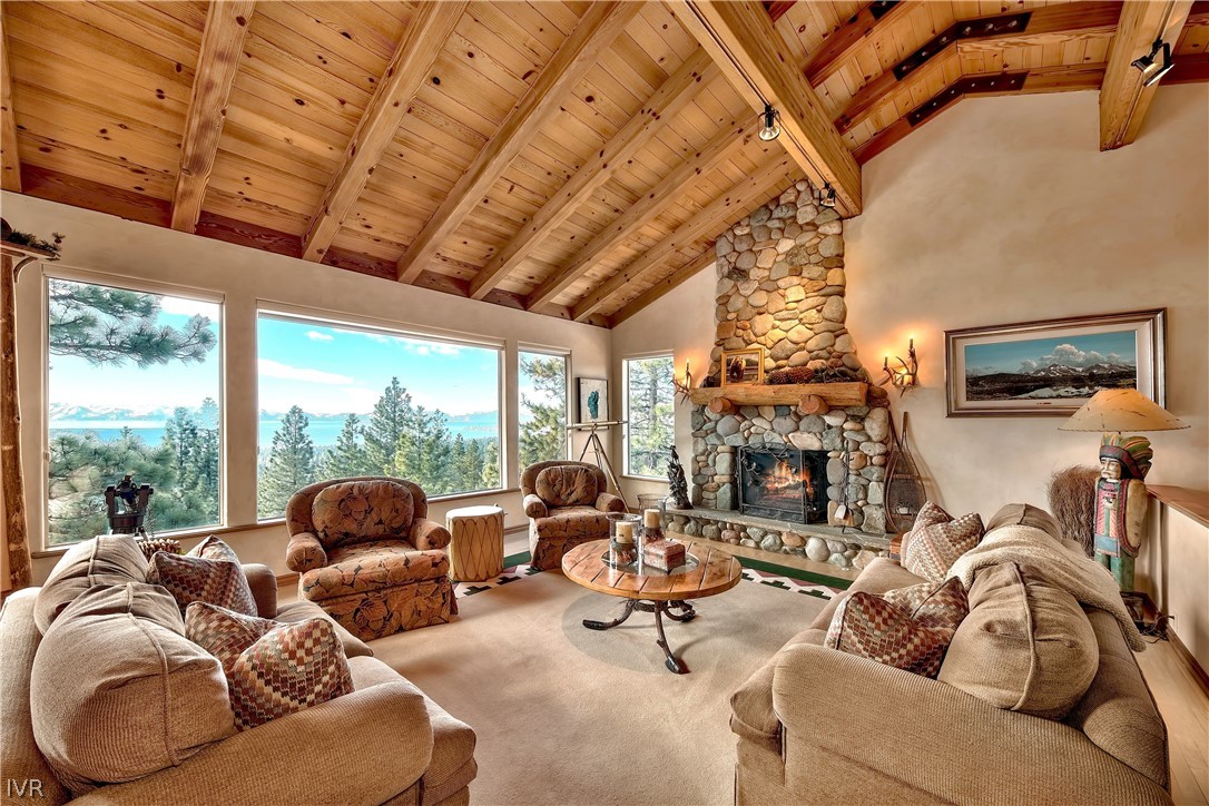 545 Alpine View Drive Incline Village, NV 89451 - Photo 1 of 34 a living room with furniture large windows and a fireplace