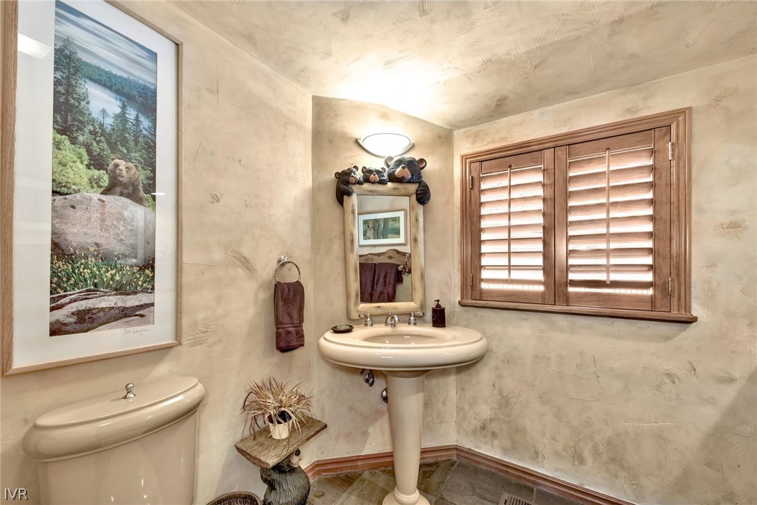 545 Alpine View Drive Incline Village, NV 89451 - Photo 17 of 34 a bathroom with a sink a toilet and a window