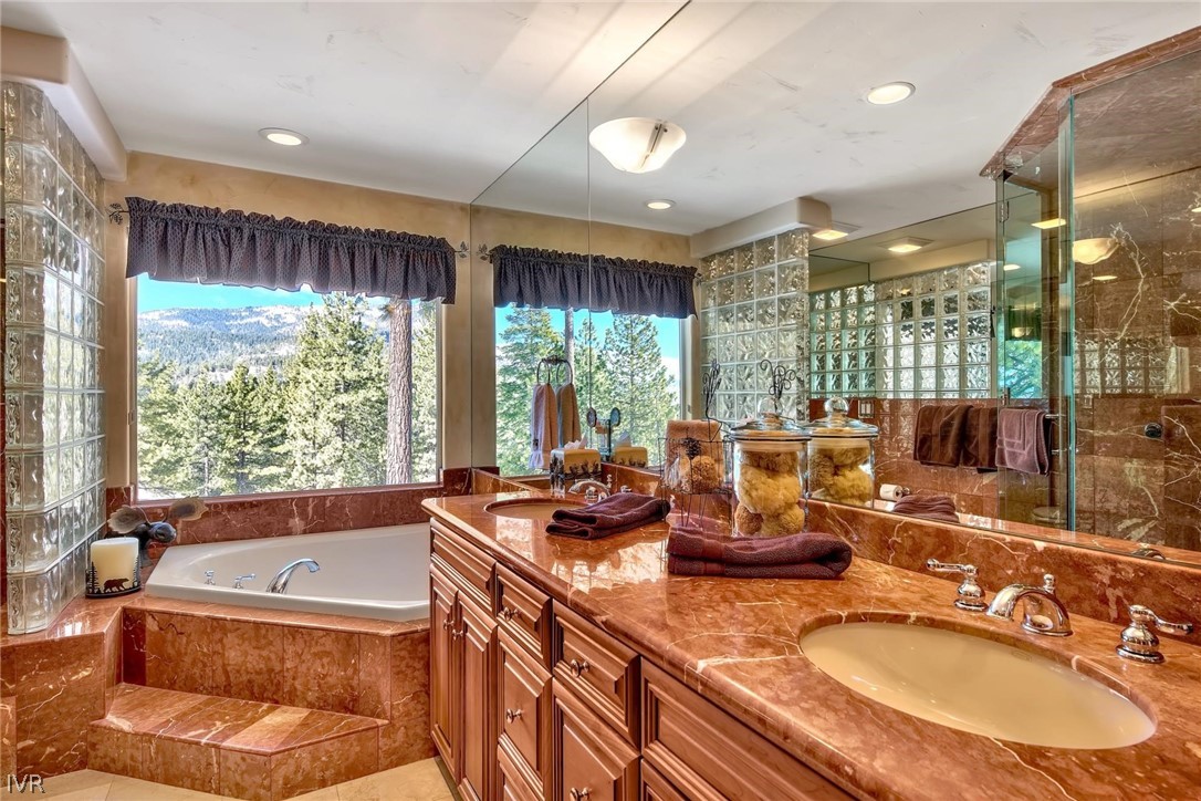 545 Alpine View Drive Incline Village, NV 89451 - Photo 20 of 34 a bathroom with a granite countertop sink and large mirror