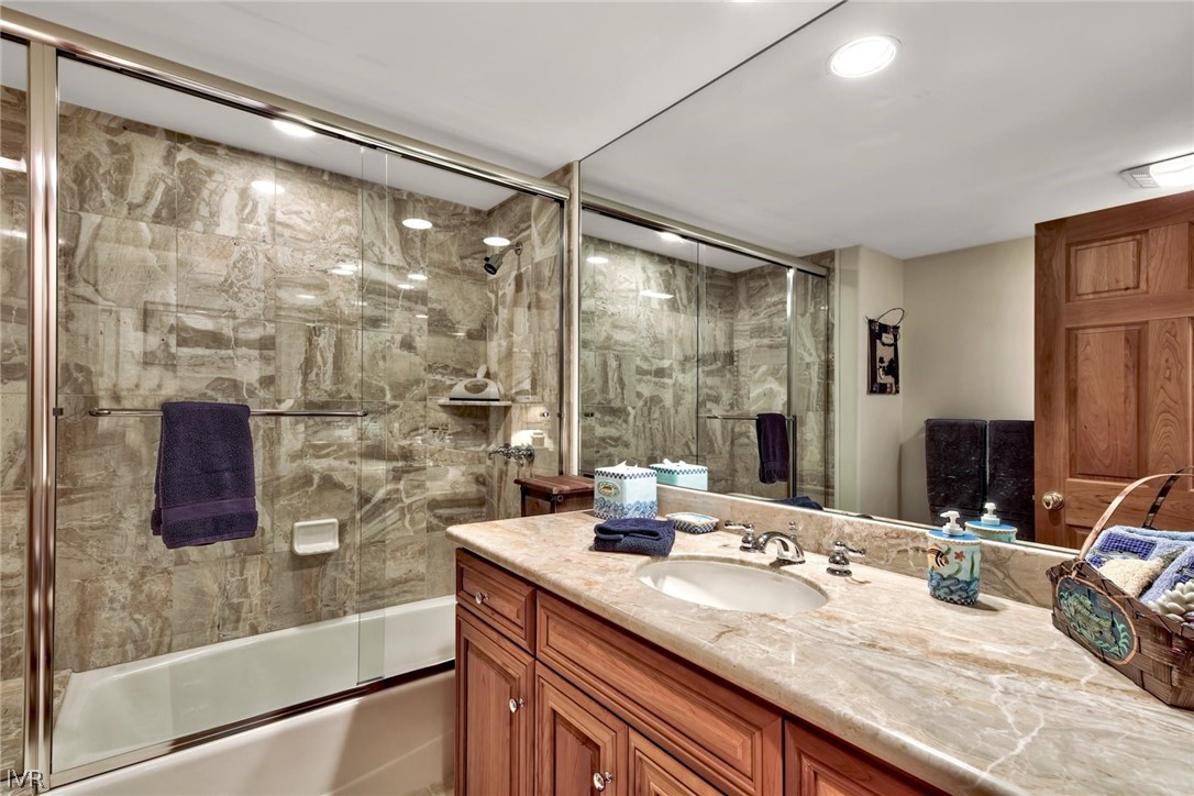 545 Alpine View Drive Incline Village, NV 89451 - Photo 29 of 34 a bathroom with a granite countertop sink a mirror and shower