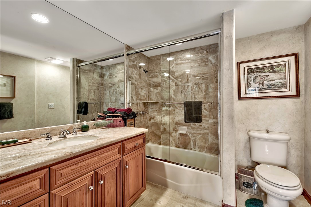 545 Alpine View Drive Incline Village, NV 89451 - Photo 31 of 34 a bathroom with a granite countertop sink toilet and shower