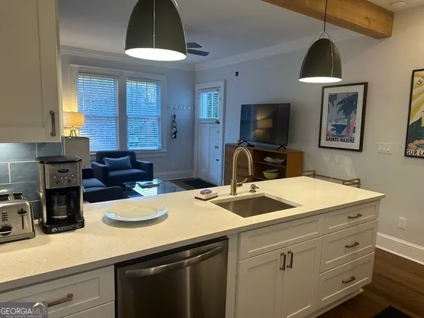 a kitchen with a stove and a microwave