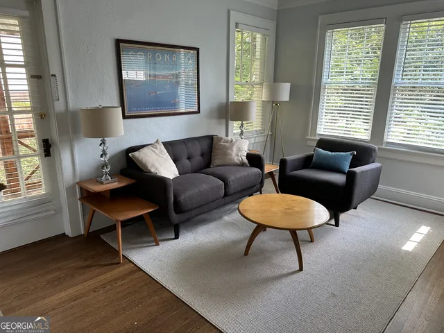 a living room with furniture and a window