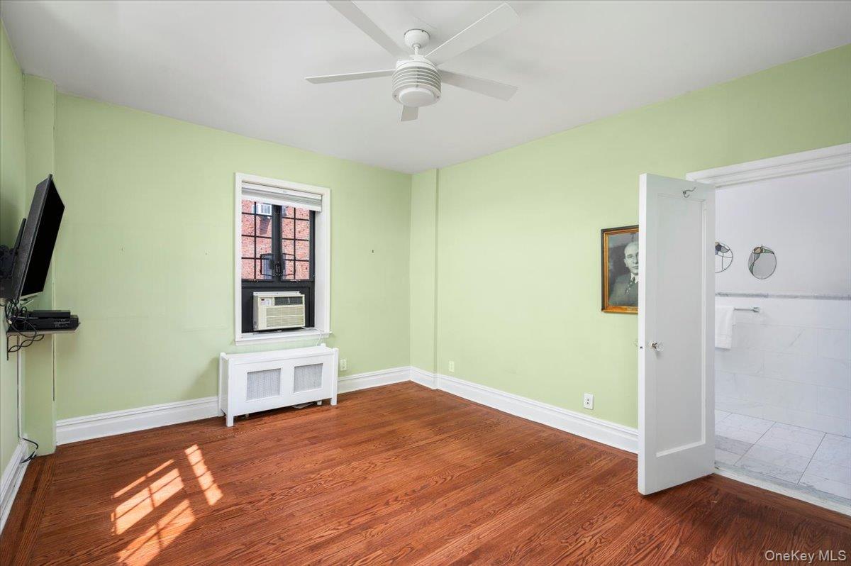 45 Pondfield Road West, Unit 4C Bronxville, NY 10708 - Photo 12 of 30 a view of empty room with wooden floor and fan
