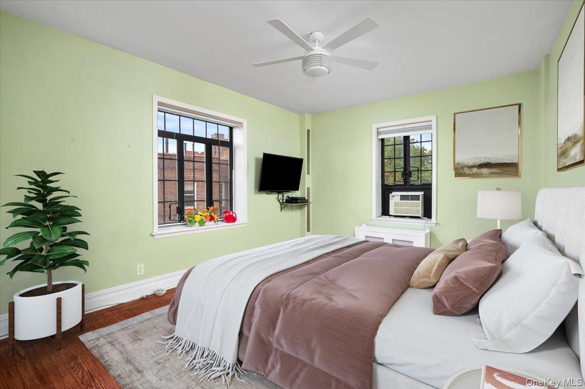 45 Pondfield Road West, Unit 4C Bronxville, NY 10708 - Photo 14 of 30 a bedroom with a large bed and a flat screen tv