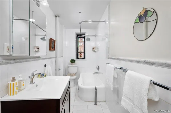 a bathroom with a sink vanity and a mirror