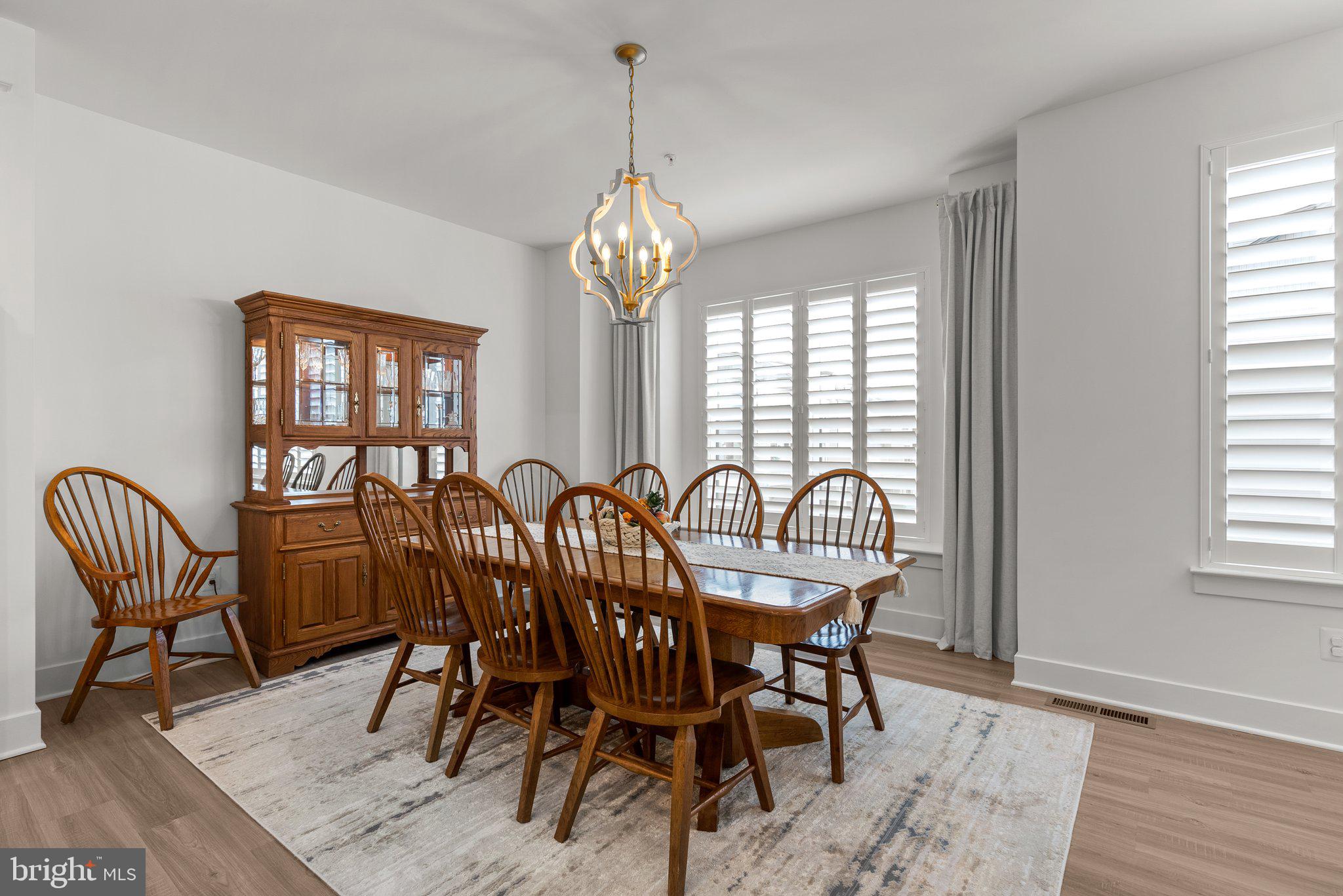 286 Alluvium Drive Laurel, MD 20724 - Photo 16 of 61 a view of a dining room with furniture window and wooden floor