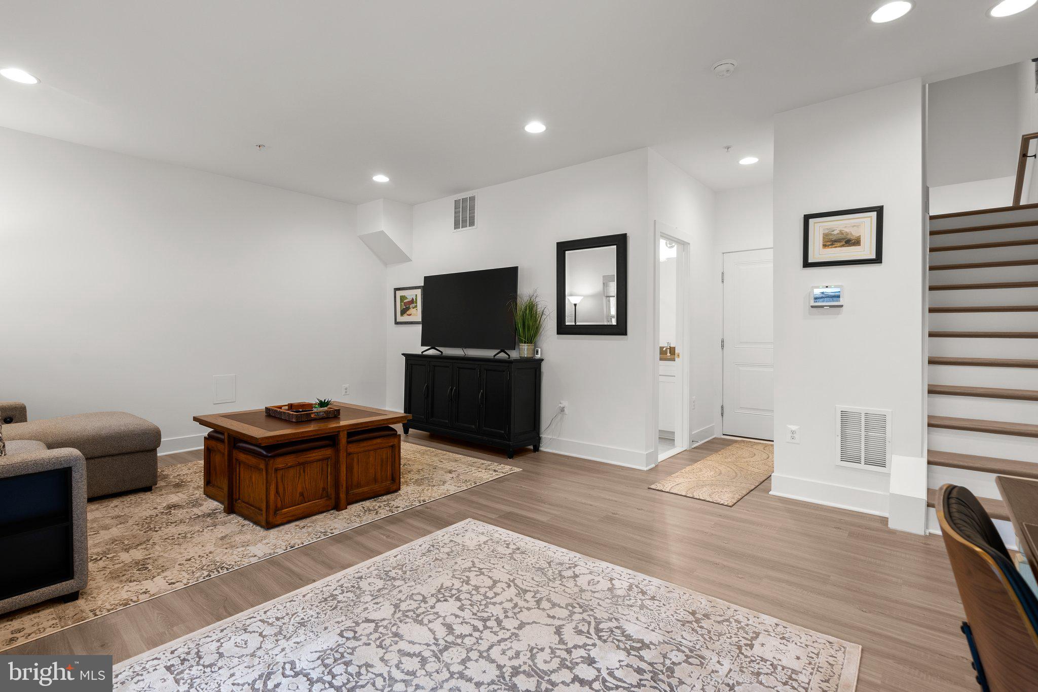 286 Alluvium Drive Laurel, MD 20724 - Photo 34 of 61 a living room with furniture and a flat screen tv