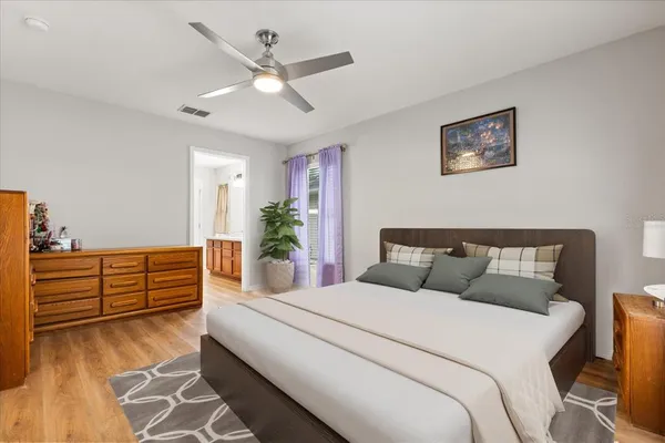 a bed room with a bed and a window