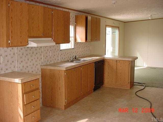 8035 Wiggins Mill Road Lucama, NC 27851 - Photo 2 of 5 a utility room with sink dryer and washer