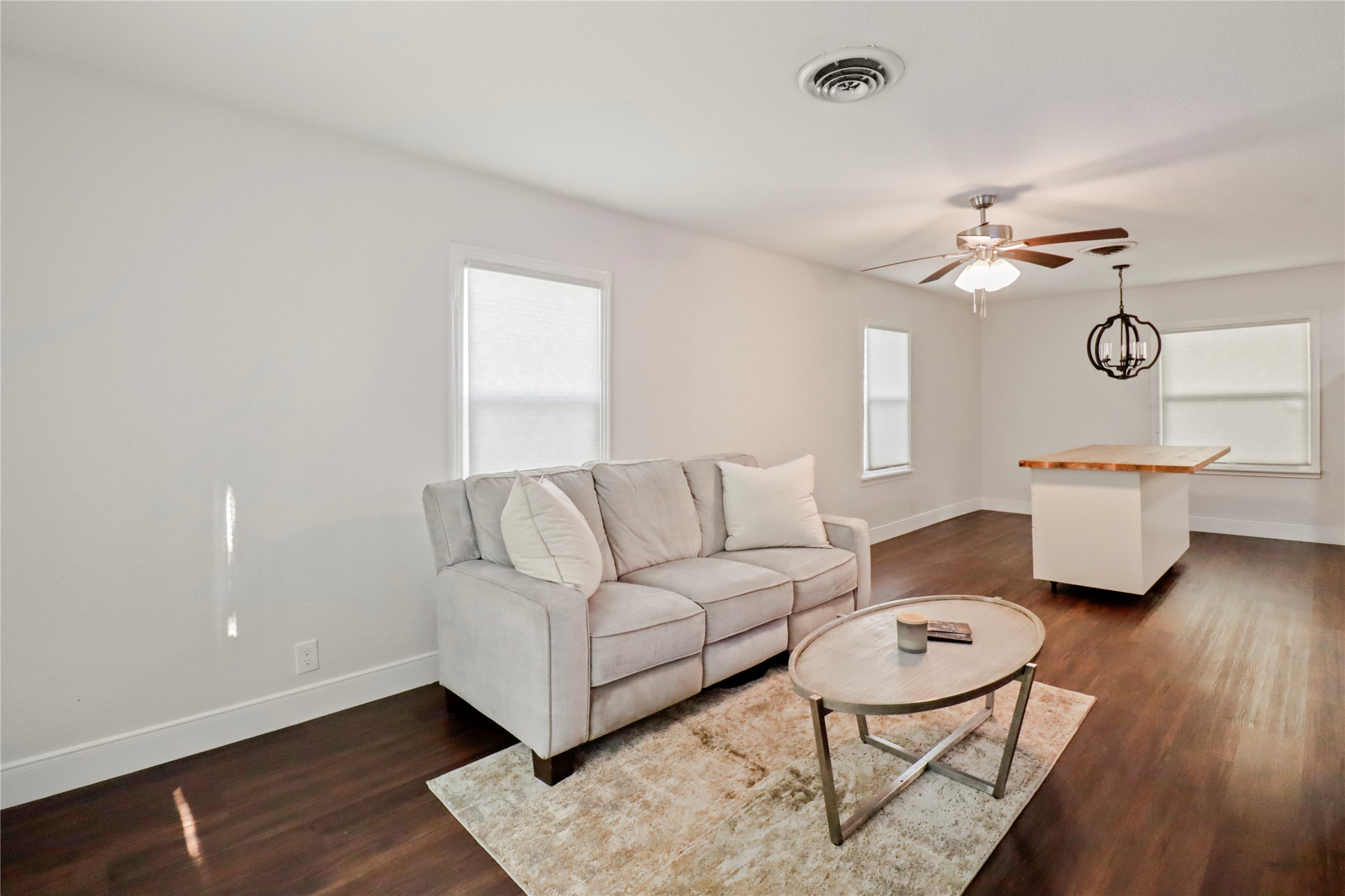 916 North Chenango Street Angleton, TX 77515 - Photo 5 of 15 a living room with furniture and a wooden floor