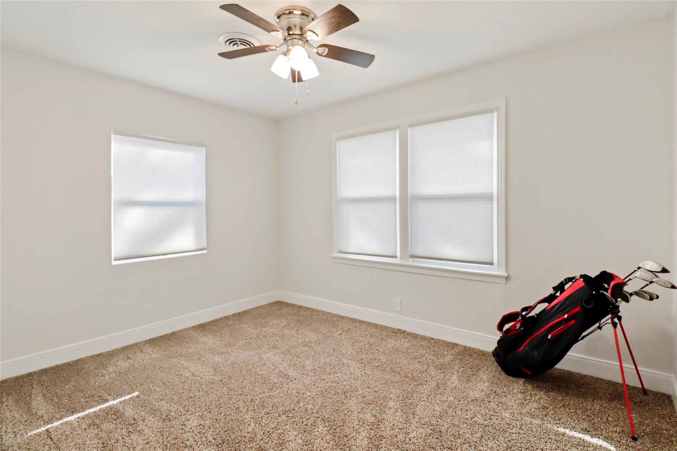 916 North Chenango Street Angleton, TX 77515 - Photo 10 of 15 a room with air conditioner and windows