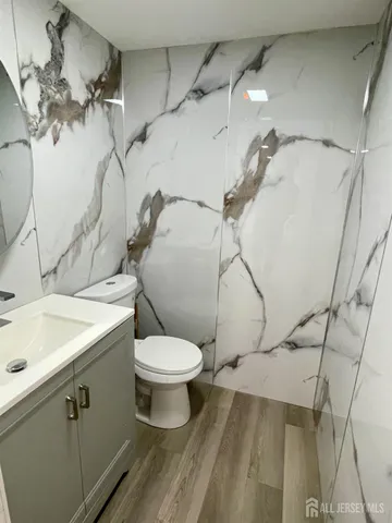a bathroom with a toilet sink and shower