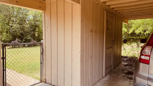 4614 Raintree Boulevard Austin, TX 78745 - Photo 13 of 14 a view of a porch with a door and wooden floor
