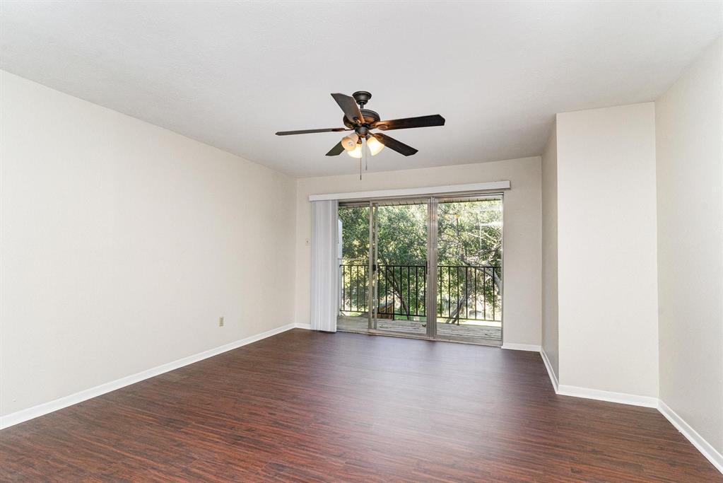 2945 Country Pl Circle Carrollton, TX 75006 - Photo 15 of 29 wooden floor in an empty room with a window
