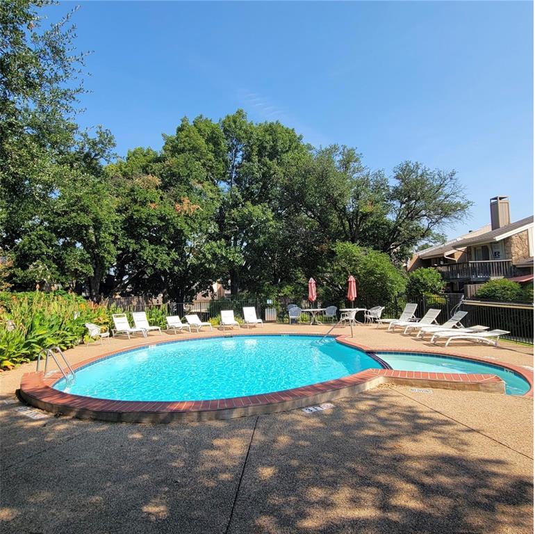 2945 Country Pl Circle Carrollton, TX 75006 - Photo 28 of 29 a view of a swimming pool with an outdoor space and seating area