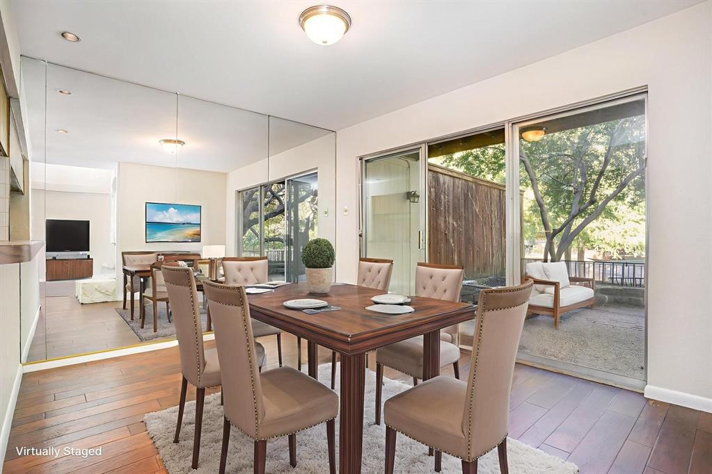 2945 Country Pl Circle Carrollton, TX 75006 - Photo 8 of 29 a view of a dining room with furniture window and wooden floor