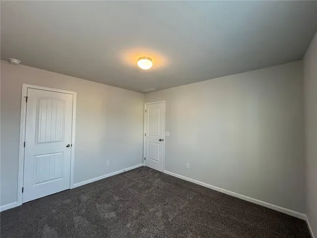 an empty room with a space and a window