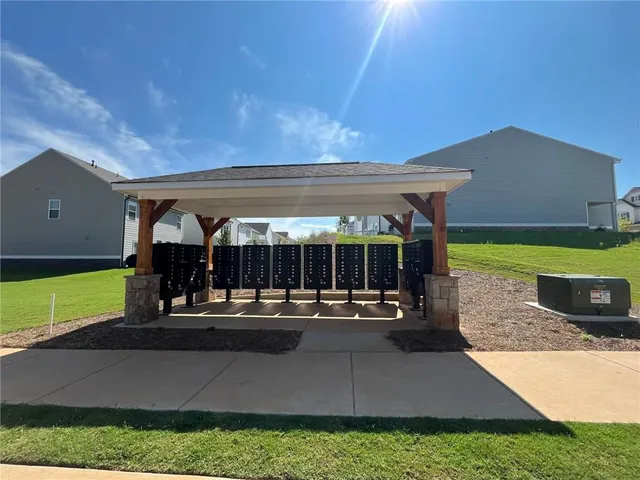 a view of a house with pool and a yard