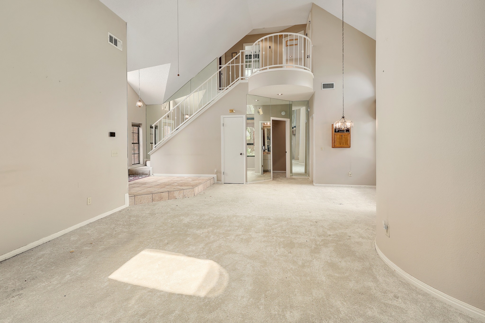 2202 Warfield Way Austin, TX 78728 - Photo 5 of 32 A grand entrance with high ceilings, an elegant staircase, and neutral flooring awaits your personal touch.