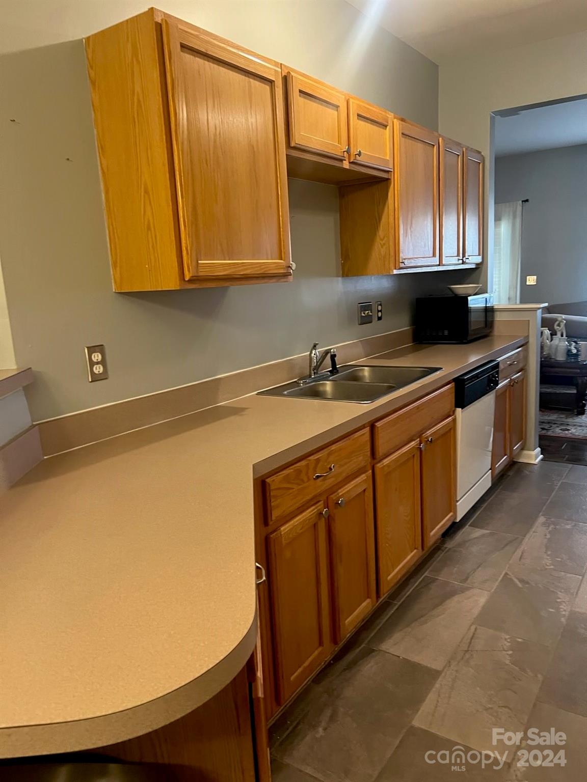 1264 Branson Road Northwest Concord, NC 28027 - Photo 13 of 37 a kitchen with stainless steel appliances a stove a microwave and sink