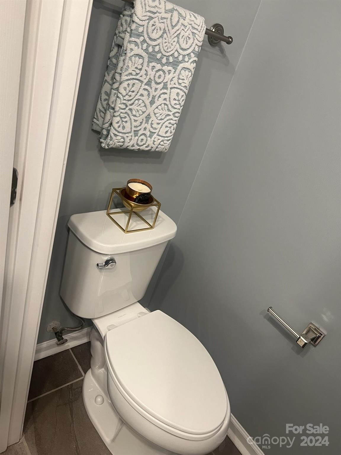 1264 Branson Road Northwest Concord, NC 28027 - Photo 5 of 37 a white toilet sitting next to a bathroom sink