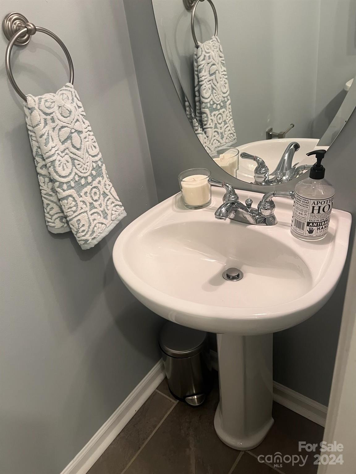 1264 Branson Road Northwest Concord, NC 28027 - Photo 6 of 37 a bathroom with a sink and a mirror