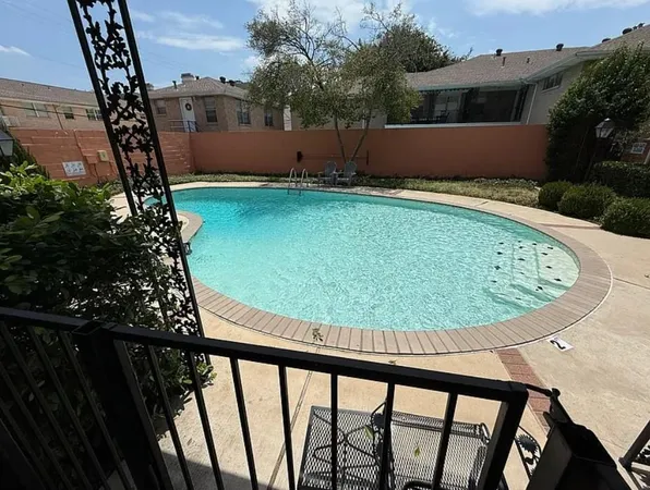 a view of a swimming pool with a porch
