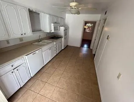 a view of a kitchen with electric appliances